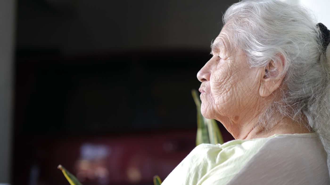 A close-up portrait of an elderly woman